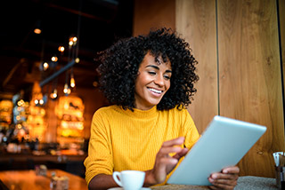 woman smiling at coffee shop