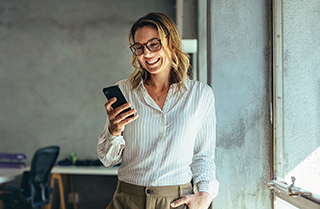 A woman taking care of her finances on her phone.