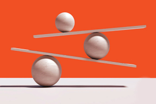 Marbles balancing on boards